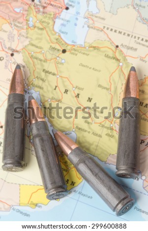 Four bullets on the geographical map of Iran. Conceptual image for war, conflict, violence.