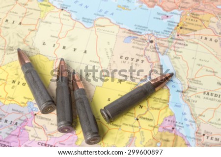 Four bullets on the geographical map of Libya and Egypt in North Africa. Conceptual image for war, conflict, violence.