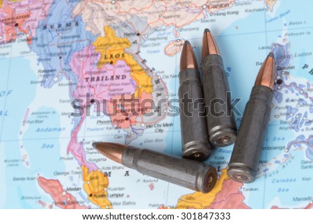 Four bullets on the geographical map of Thailand, Laos and Vietnam. Conceptual image for war, conflict, violence.