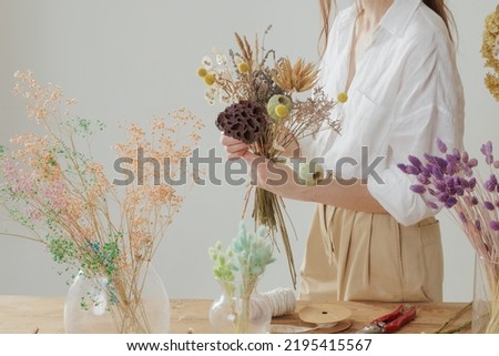 Image, Stock Photo Arranged bouquet of dried flowers and grasses in natural colours in autumn sunshine in front of a nursery in Oerlinghausen near Bielefeld in the Teutoburg Forest in East Westphalia-Lippe