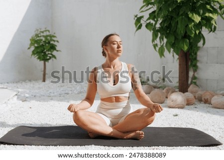 Similar – Image, Stock Photo Barefooted women practicing yoga in mountain pose