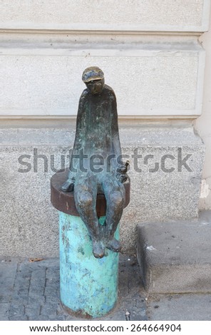 Tbilisi,GE-Feb,25 2015: Sculpture of a seated man with a bottle in his hand on the street Rustaveli in Tbilisi