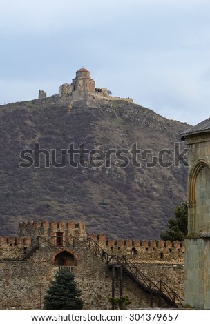 Ancient temple-monastery of Jvari on the mountain. View from the territory of the Svetitskhoveli Cathedral in the center of Mtskheta. Georgia