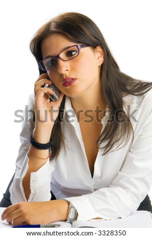 a young and cute brunette as secretary with glasses wearing a white shirt and talking with mobile