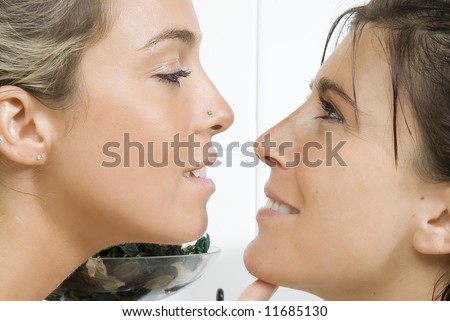 two girls face to face looking each others in the eyes