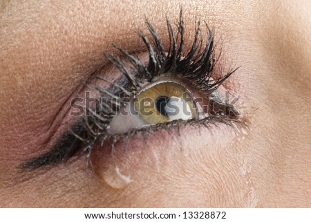 close up on the eyes of a young woman crying