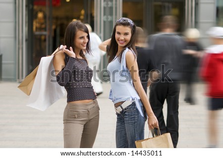 two girls enjoying their time after an afteroon in a commercial center
