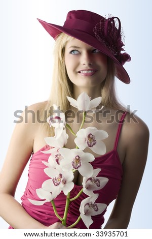pretty young girl with flowers present wearing a red hat
