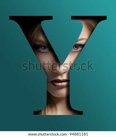 close up beauty portrait of young pretty woman behind a color baby blue letter Y