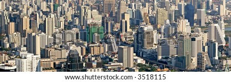 Panoramic view across the city of Bangkok, showing syscrapers of apartments and office blocks