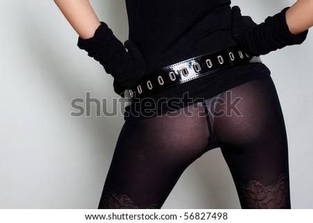 Sexual girl in black clothing on the white background