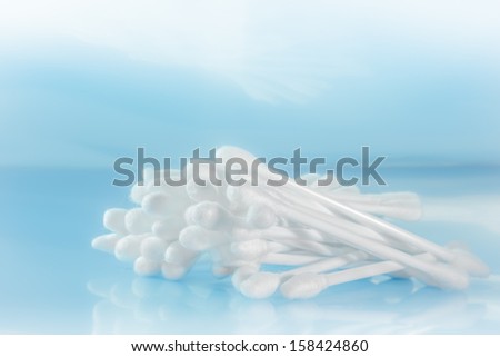 group of cotton bud on light blue background.
