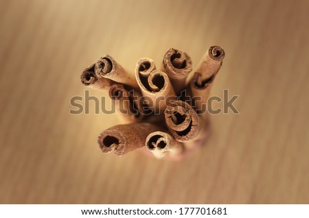 Cinnamon on wooden background,top shot and select focus.