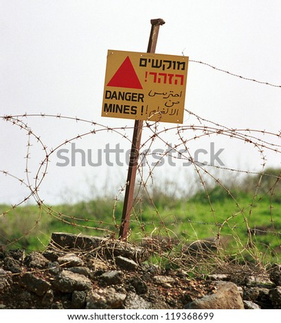 ISRAELI-SYRIAN BORDER - MARCH 28:   A sign warns of a mine field along the Israeli-Syrian border high in the Golan Heights on March 28, 2000 on the Istaeli-Syrian border.