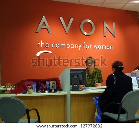 BUDAPEST - NOVEMBER 12: Shoppers speak with a retail representative at an office of Avon cosmetics in Budapest, Hungary, on November 12, 2003.