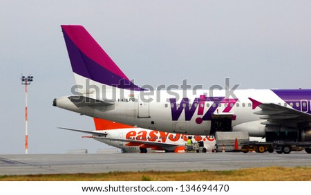 BUDAPEST - JUNE 12: A WizzAir airplane on the tarmac at Ferihegy International Airport in Budapest, Hungary, on Sunday, June 12, 2005. Behind it is an airplane of budget carrier EasyJet.