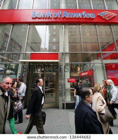NEW YORK CITY - APRIL 19: Pedestrians walk past a Bank of America branch office  in New York City, on Friday, April 19, 2013.