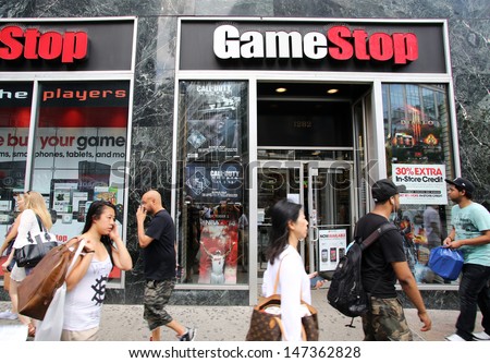 NEW YORK CITY - JULY 8: Shoppers walk past a GameStop retail store in New York City, New York, on Monday, July 8, 2013. GameStop Corp. is an American video game and entertainment software retailer.