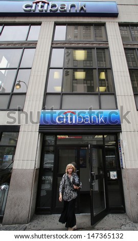 NEW YORK CITY - JULY 11: Pedestrians walk past a Citibank bank branch in midtown Manhattan on Thursday, July 11, 2013.