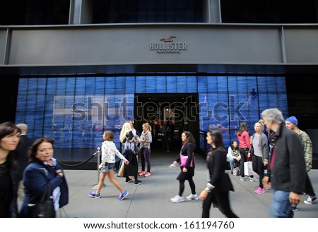 NEW YORK CITY - OCT 18:  Pedestrians walk past a a Hollister clothing store in Manattan on Friday, October 18, 2013. Hollister Co.  is an American lifestyle brand by Abercrombie & Fitch Co