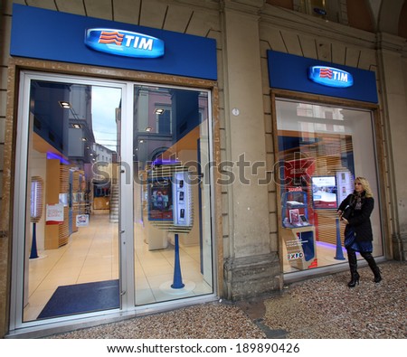 BOLOGNA, ITALY - APRIL 19, 2014: A pedestrian walks past a TIM (Telecom Italia Mobile) retail shop in Bologna, Italy, on Saturday, April 19, 2014.