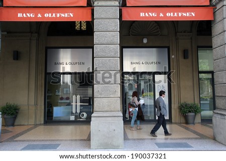 BOLOGNA, ITALY - APRIL 19, 2014: Pedestrians walk past a Bang & Olufsen (B&O) home electronics store in Bologna, Italy, on Saturday, April 19, 2014.