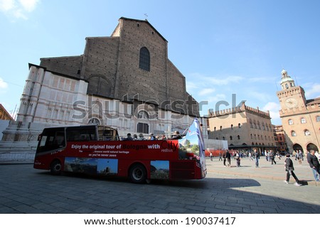 BOLOGNA, ITALY - APRIL 19, 2014: Tourists enjoy a tourthrough the city in a guided bus tour in Bologna, Italy, on Saturday, April 19, 2014.