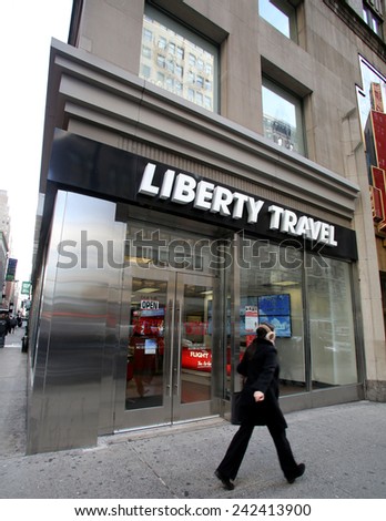 NEW YORK CITY - MONDAY, DEC. 29, 2014: Pedestrians walk past a Liberty Travel agent. Liberty Travel is an American retail travel and cruise company owned by Flight Centre Ltd.