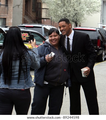NEW YORK CITY - APRIL 15: Actor Will Smith greets a crowd of fans on the set of Men In Black 3 (MIB3) which is being filmed in New York City on April 15, 2011.