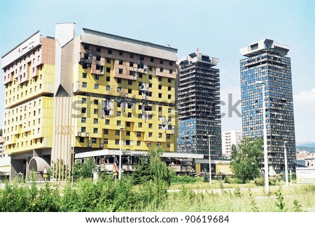 SARAJEVO, BOSNIA - JUNE 12: An exterior view of the Holiday Inn hotel and the UNIS towers in Sarajevo, Bosnia, on Saturday, June 12, 1993. The hotel houses the foreign press corps, and is frequently targeted by gunfire.