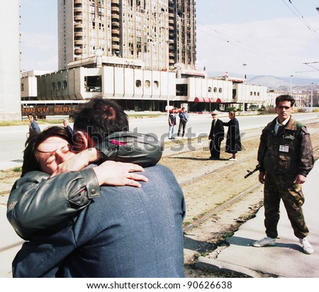 SARAJEVO, BOSNIA - APR 24: A woman collapses in tears after being reunited with loved ones in front of a French UNPROFOR checkpoint in Sarajevo, Bosnia, on Sunday, April 24, 1994.