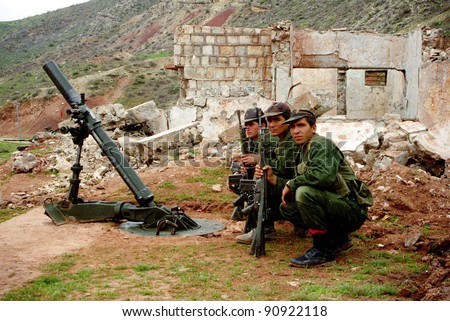 NORTHERN IRAQ - MAY 3: Turkish troops, with a large mortar, take a rest during their campaign  in northern Iraq. Turkey has again sent in its army to crush Kurdish guerrilla forces on May 3, 1998 in Northern Iraq.