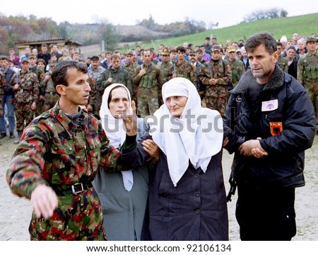 RETMILJE, KOSOVO, 12 NOVEMBER 1998 -  Kosovo Liberation Army (KLA) soldiers and family members attend a funeral for their commander, killed recently during fighting with Serb forces, in central Kosovo