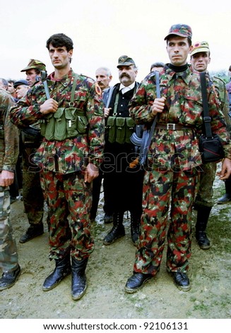RETMILJE, KOSOVO, 12 NOVEMBER 1998 -  Kosovo Liberation Army (KLA) soldiers and family members attend a funeral for their commander, killed recently during fighting with Serb forces, in central Kosovo