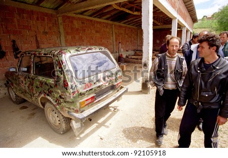DRENICA, KOSOVO, 09 JULY 1998 Members of the Kosovo Liberation Army show off a Russian-made Lada Niva jeep with  Kosovo Liberation Army symbols on all four doors at a base in western Kosovo.