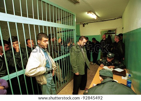 MOSCOW - SEPTEMBER 20: Moscow police process 50 Caucasian men and women, arrested earlier as part of a sweep to catch those responsible for a string of deadly bombings which killed 300 Russians on September 20, 1999 in Moscow