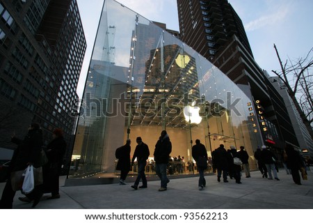NYC - DEC 30: Pedestrians walk past an official Apple, Inc.  retail center in New York City, New York, on Wednesday,  December 30, 2009.