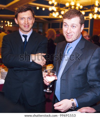 MOSCOW, RUSSIA - MAR 29: Russian oligarch Oleg Deripaska, left, and Roman Abramovich, attend a meeting between Russian president Vladimir Putin and Russian businessmen in the Kremlin on Wednesday, March 29, 2006.