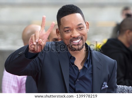 MOSCOW, RUSSIA - MAY 27: Will Smith takes photo with a fan during a photo-call for the film After Earth on May 27, 2013 in Moscow