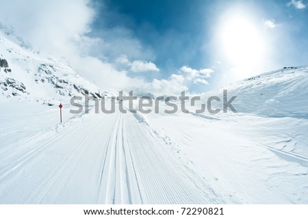 beautiful winter landscape with skiing tracks well groomed for cross country skiing