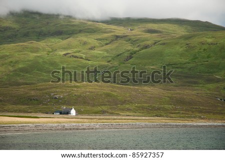 seaside cabin in beautiful landscape under the mountains