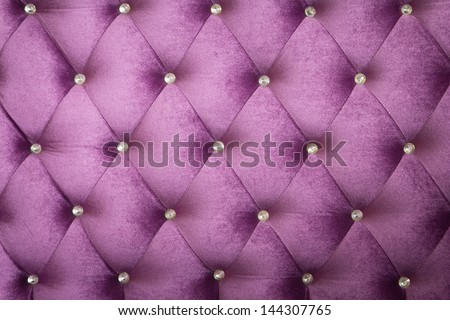 Purple velvet cushion is beautiful backdrop.