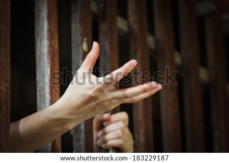 prisoner hand asking for food in jail