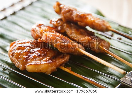 Asian grilled pork served with rice.