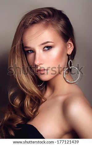 beautiful woman\'s face of model with clean skin and a make-up on a white background