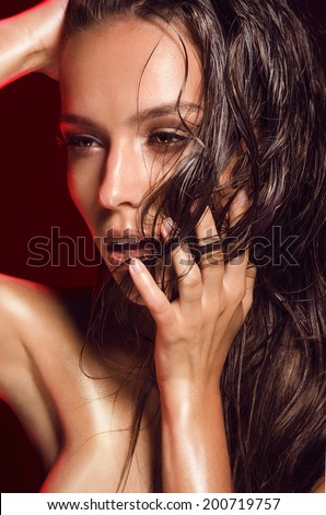 portrait of hot girls with dark hair, tanned shiny skin, wet, in oil, burning sun