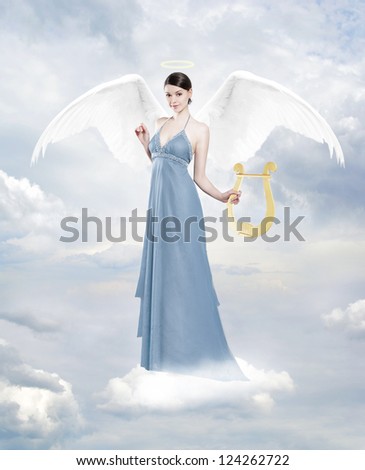 Angel with lyre. Gorgeous young brunette woman as an angel in clouds with lyre and halo
