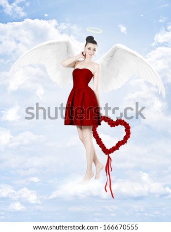 Beautiful brunette woman as cupid with heart made of red roses
