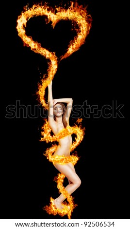 Sexy nude woman with burning heart and flames on black background