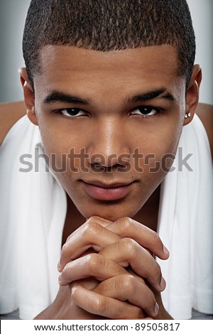 Full face portrait of a african young man  in the studio